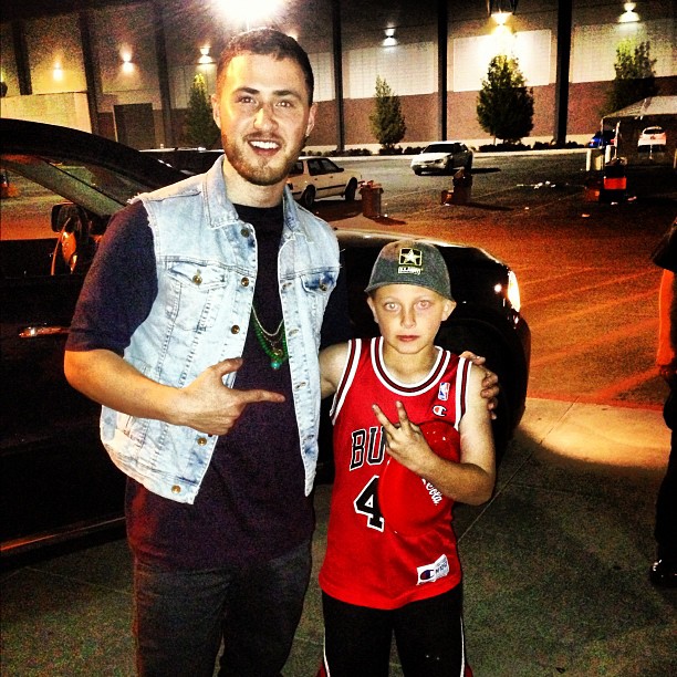 Mike Posner with a young fan - Boise, ID 5/4/13
