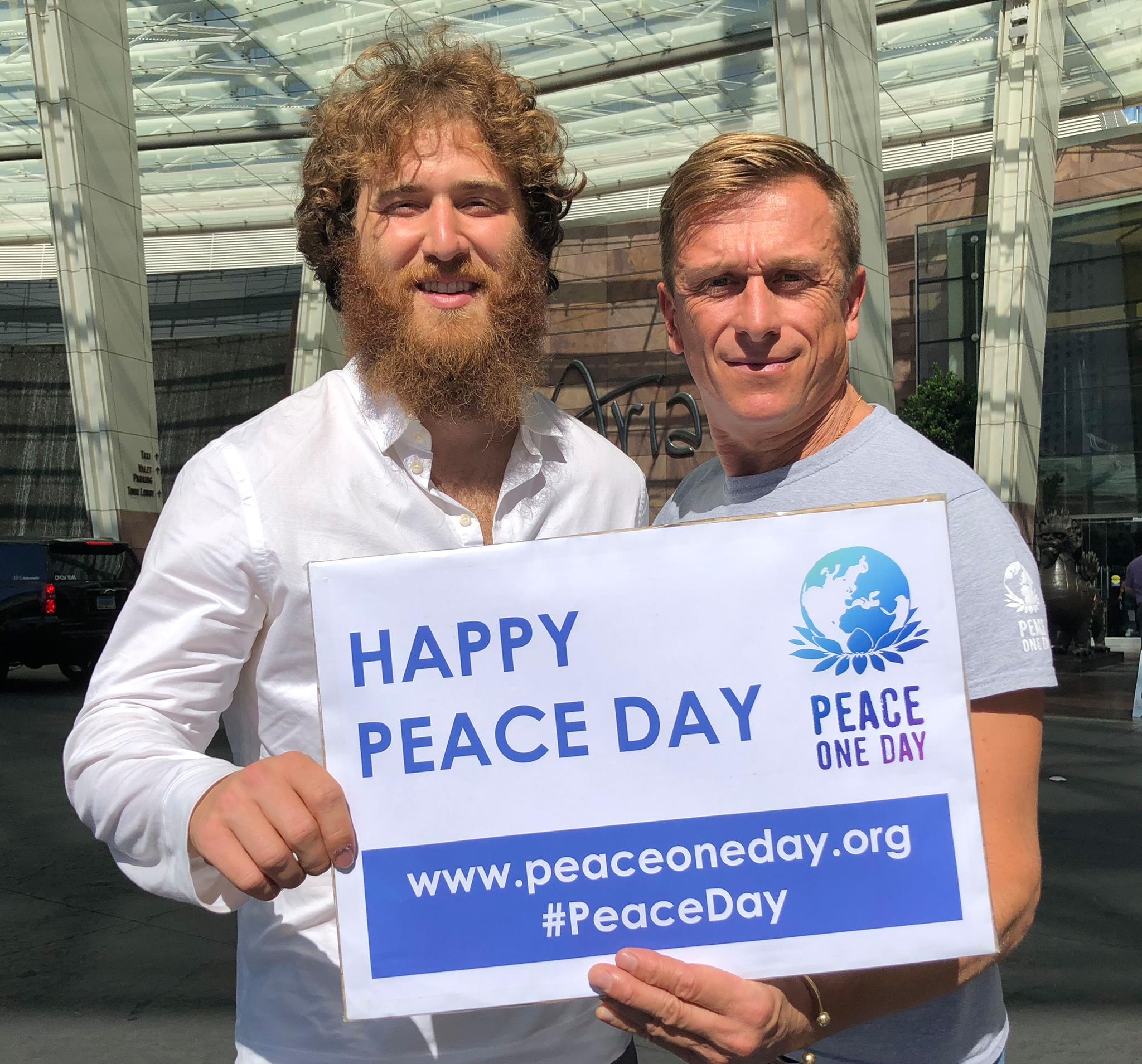 Jeremy Gilley and Mike Posner at iHeartRadio Music Festival to raise awareness of Peace Day on September 21, 2018
