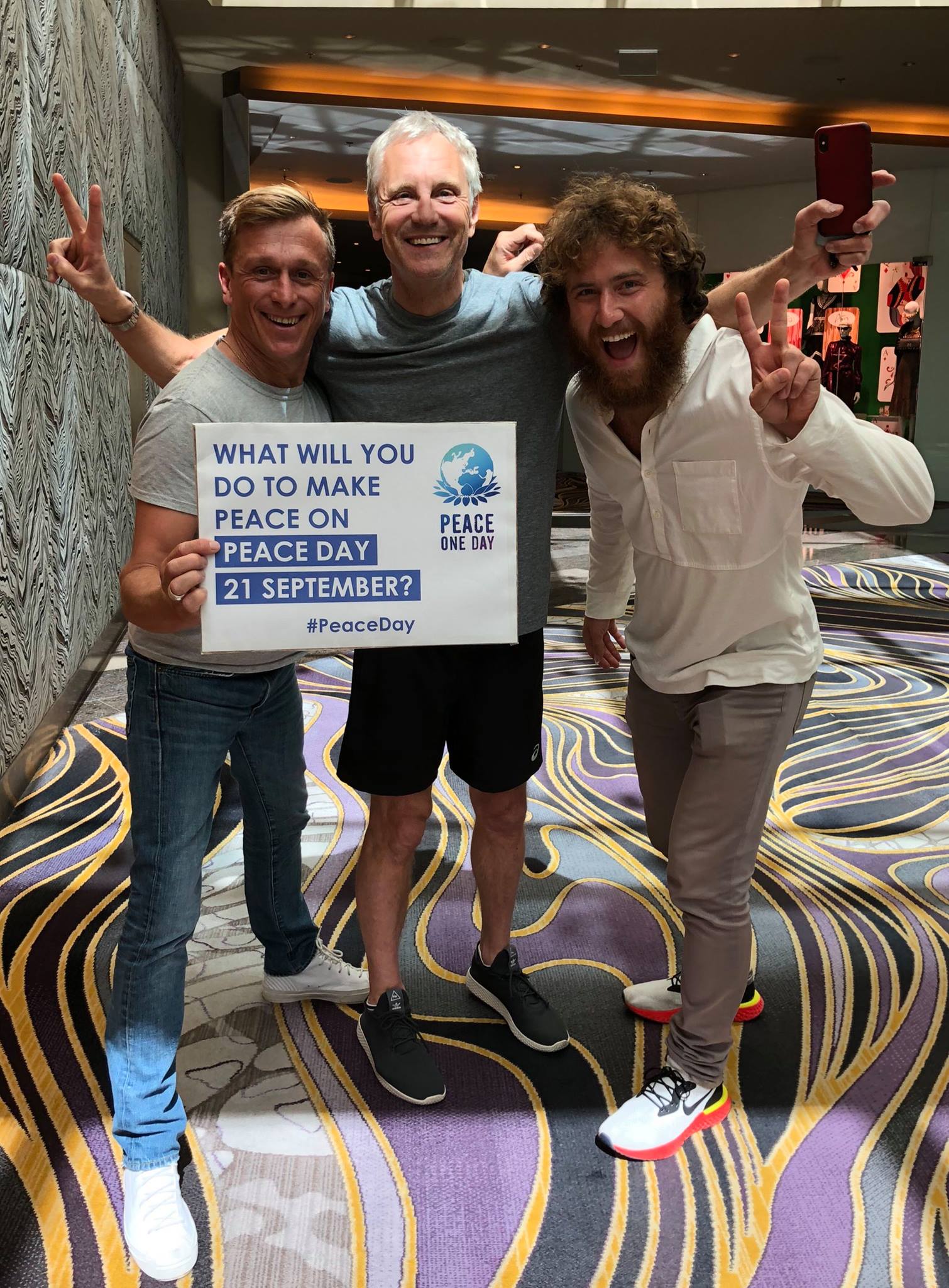 Jeremy Gilley and Mike Posner at iHeartRadio Music Festival to raise awareness of Peace Day on September 21, 2018
