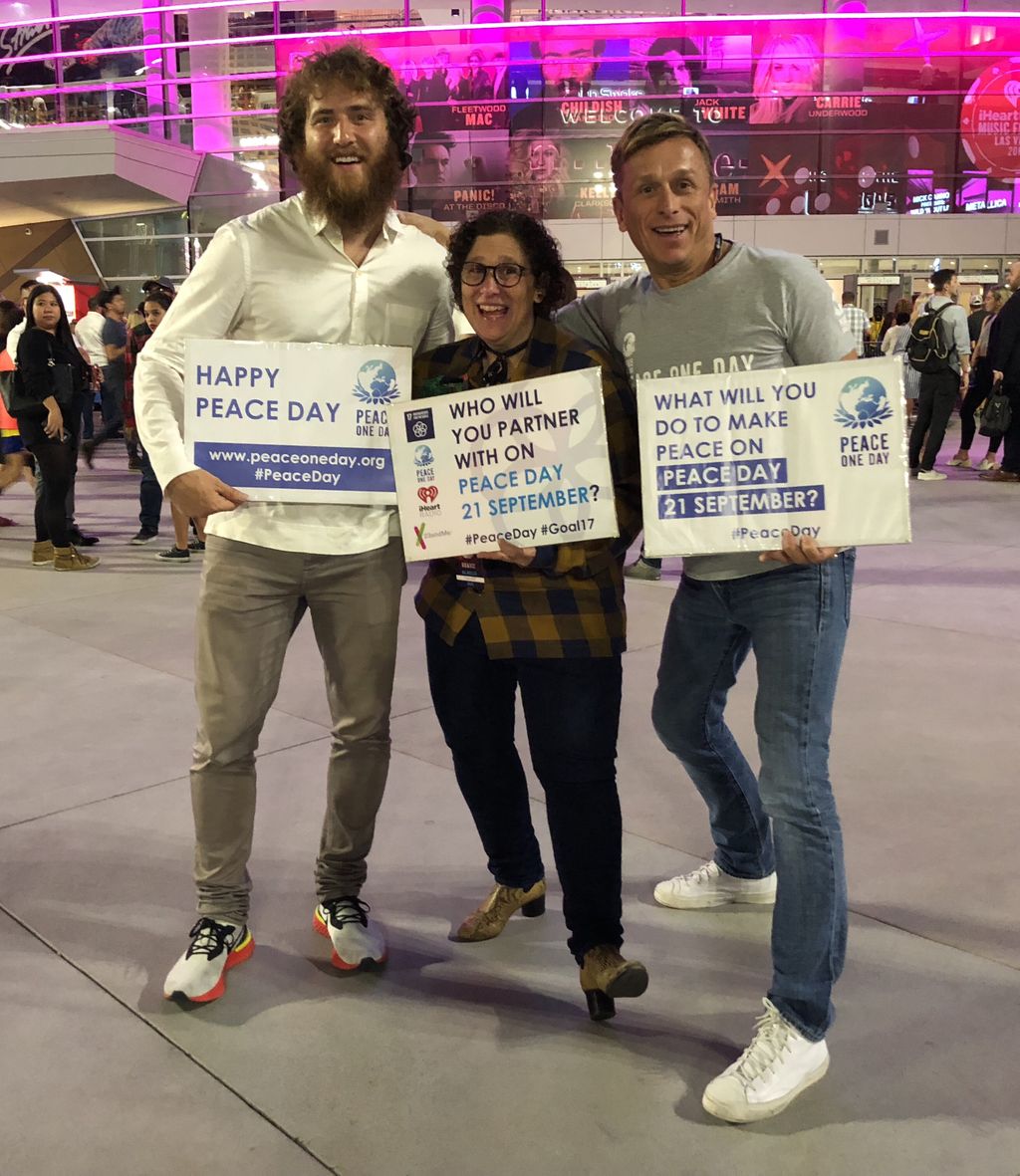 Jeremy Gilley and Mike Posner at iHeartRadio Music Festival to raise awareness of Peace Day on September 21, 2018
