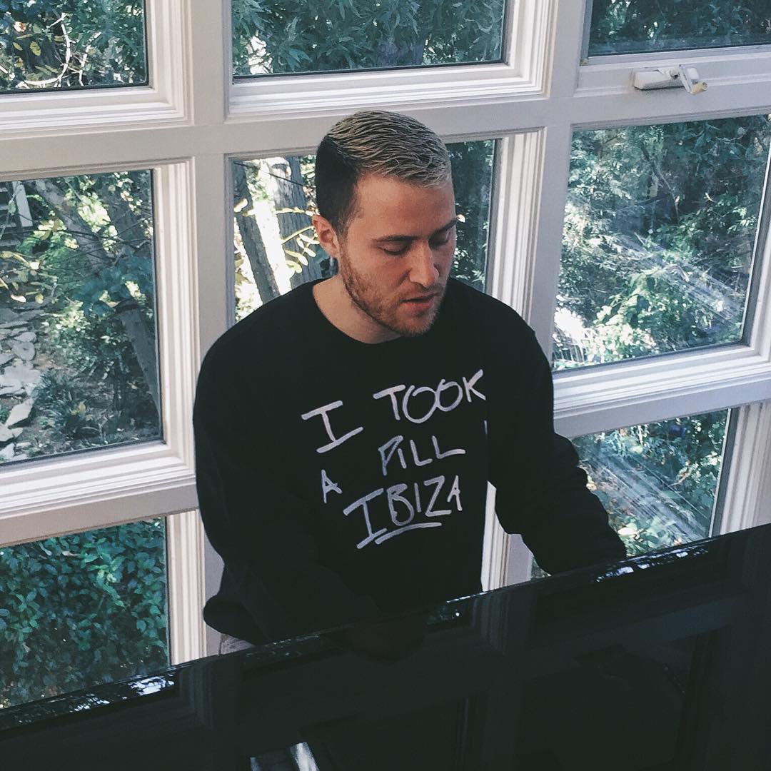 Mike Posner wearing his "I Took A Pill In Ibiza" limited edition charity sweatshirt in black
