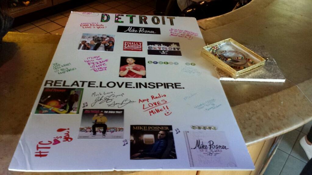 Angel gave Mike Posner the poster, 2 necklaces, and a notebook.