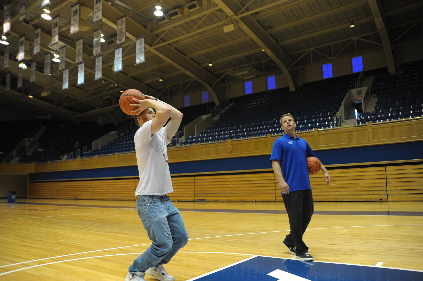 Mike Posner and Coach Steve "Wojo" Wojciechowski playing basketball at Cameron Indoor Stadium at Duke University 8/13/13
Photo by dukeblueplanet.com
