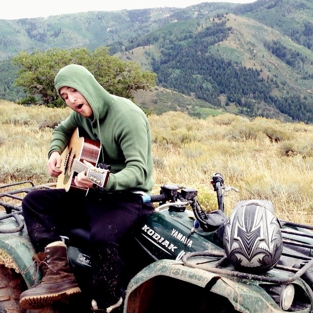 Mike Posner singing and playing guitar on top of a mountain in Utah 9/15/13
