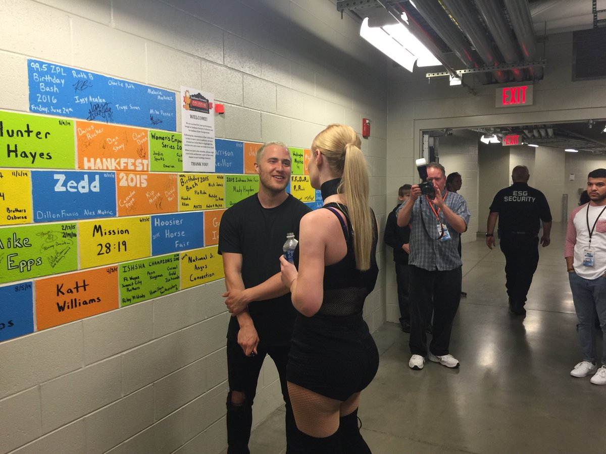 Mike Posner and Iggy Azalea speaking backstage at 99.5 WZPL Birthday Bash 2016
