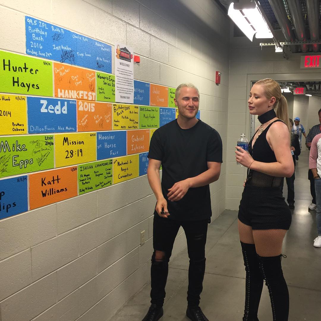 Mike Posner and Iggy Azalea speaking backstage at 99.5 WZPL Birthday Bash 2016
